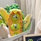 Plush squeaky dog toy in a textured corn velvet body, one design from the assorted shape range