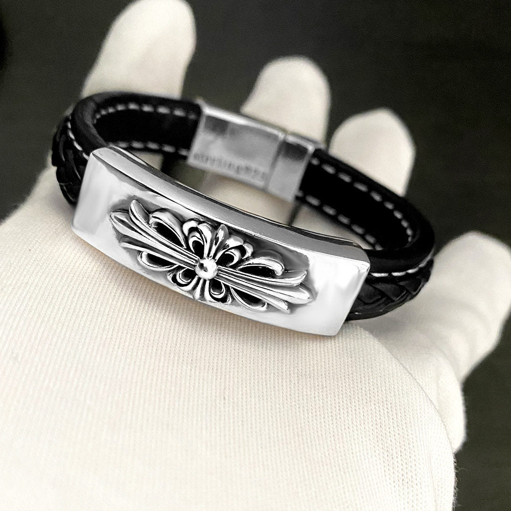 Two black leather concho cuffs paired and stacked together on the wrist