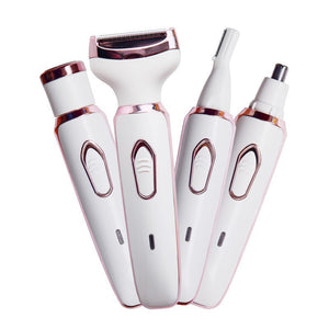 White and rose gold electric grooming kit with a foil shaver and trimmer heads