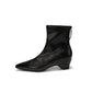 Black pointed toe ankle boot with a curved wedge heel and back zip, size 37 option