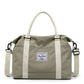 Green weekender bag shown with removable crossbody strap