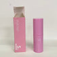 Pink collagen balm skincare product, showing the pink eye patch curved on the open jar