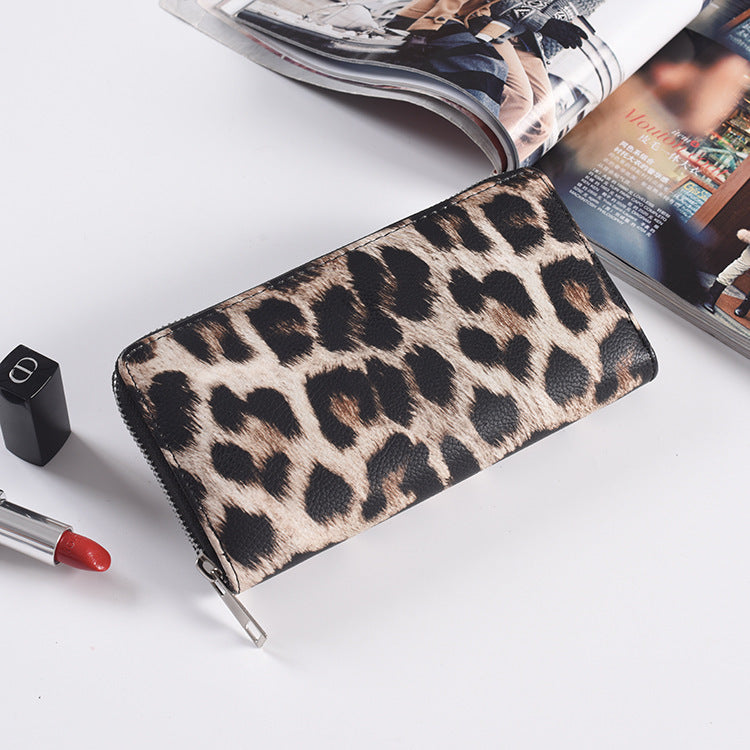 Zebra print zip around long wallet in black and white textured PU