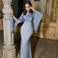 Slim-fit dress worn while moving, showing the smooth body-skimming drape