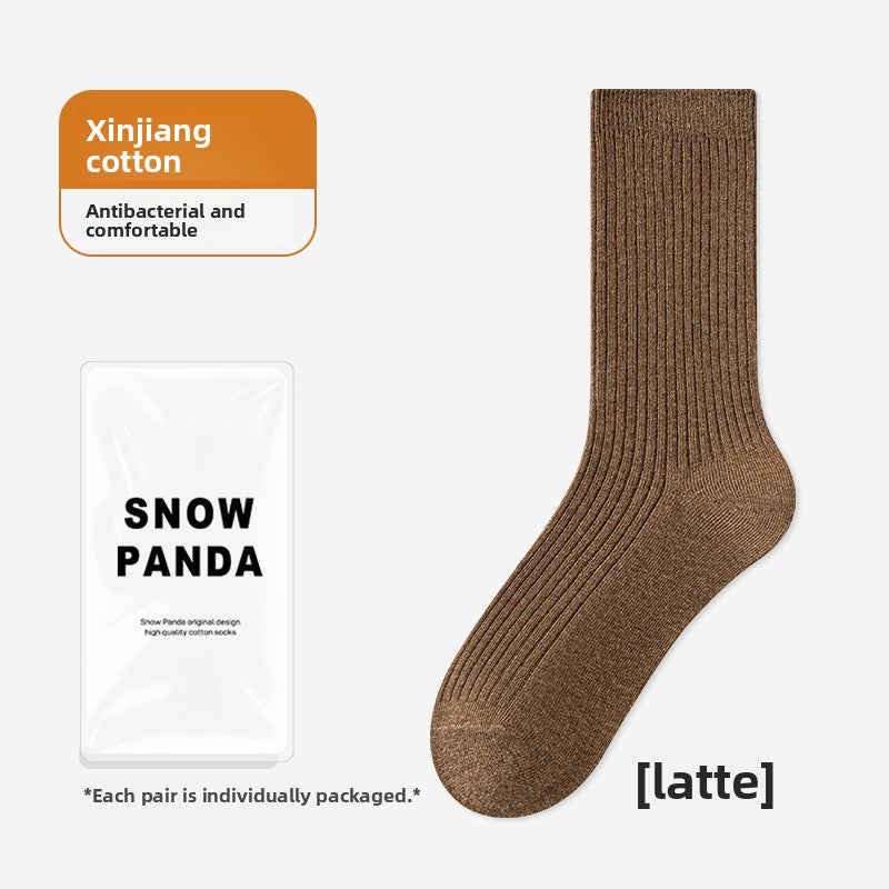 Latte brown ribbed mid-calf socks laid flat beside their individual pack, free size