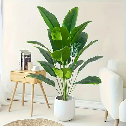Artificial traveler banana plant with green PVC leaves styled in a corner pot