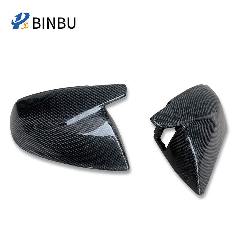 Two carbon fiber mirror covers on a white background, one of them with a cutout opening at its inner fin