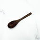 Coconut Shell Bowl with Wood Utensils | on a clean studio background