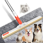Long handle pet hair remover with a wide gold-tone edge on a gray carpet beside a cat and two dogs, long handle version shown