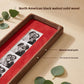 Close view of a walnut frame with red lining and a photo strip, showing the natural wood grain
