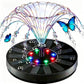 Solar fountain with colorful water arcs and red, blue and green LED beads around the spray head