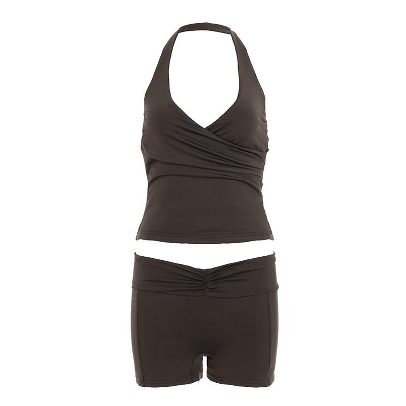 Two-piece halter top and high-waist shorts set shown on a model outdoors