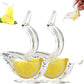 Two clear acrylic bird shaped citrus juicers each holding a bright lemon wedge in the open belly