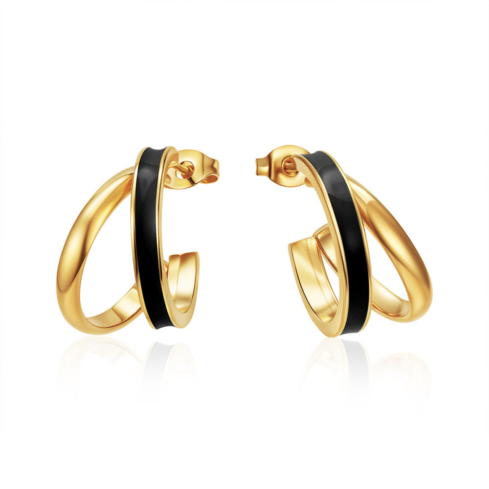 Pair of black enamel gold plated double band C-shaped hoop stud earrings on white