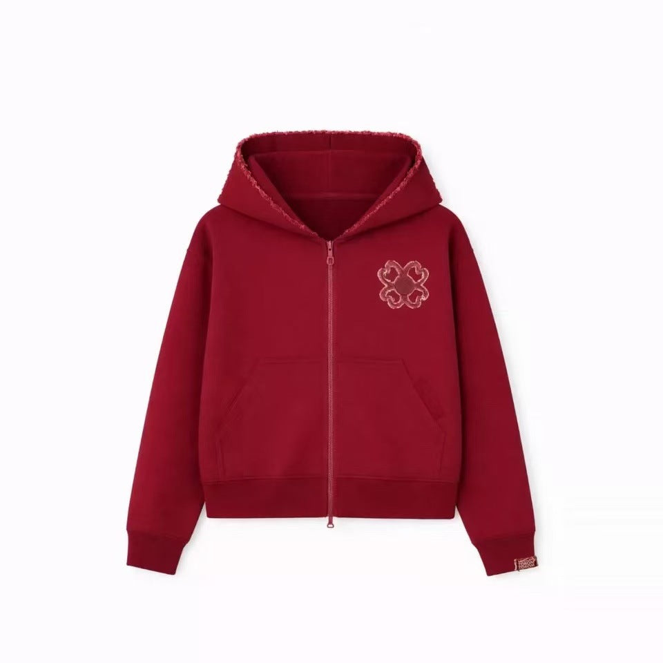 Red option photo of a deep red zip hoodie flat lay with frayed hood edge and chest clover, size L