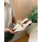 Pointed toe leather mules arranged as a group in five colours