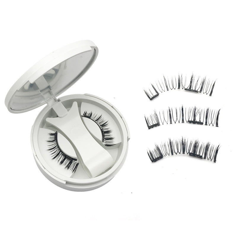 Pair of magnetic false eyelashes resting in the round compact case