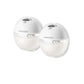 Two white wearable electric breast pumps on a plain background with display and button