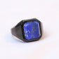 Blue lapis lazuli square stone signet ring on a hand with a stainless steel band