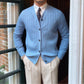 Sky blue ribbed knit mens cardigan hem and button placket shown in daylight