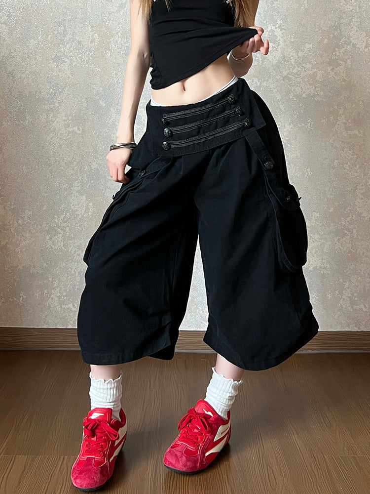 Black cotton wide leg cropped cargo pants with a double row buttoned waistband on a model