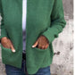 Green zip-front knit cardigan with two patch pockets, size S