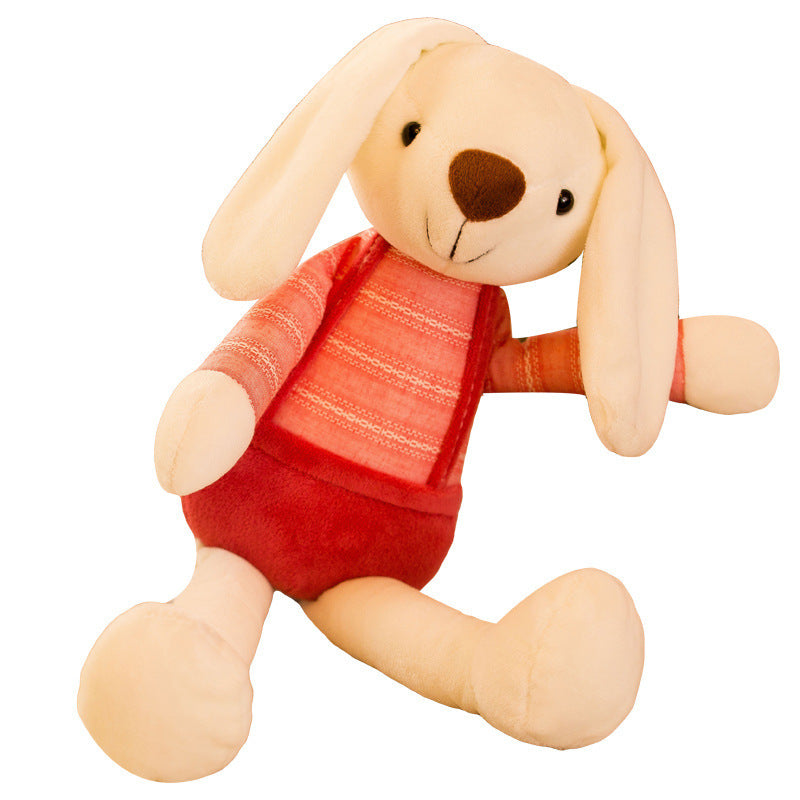 Cream plush rabbit with long floppy ears in a coral striped top and red shorts on a white background