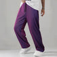 Mens pleated straight leg pants paired with trainers for a casual outfit