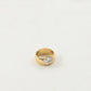 Close-up of the faceted zircon and polished gold plating on the ring band