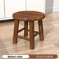 Solid rubberwood stool holding a potted plant as a low corner display stand