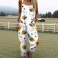 Sleeveless dungaree jumpsuit in a digital print with two deep front pockets