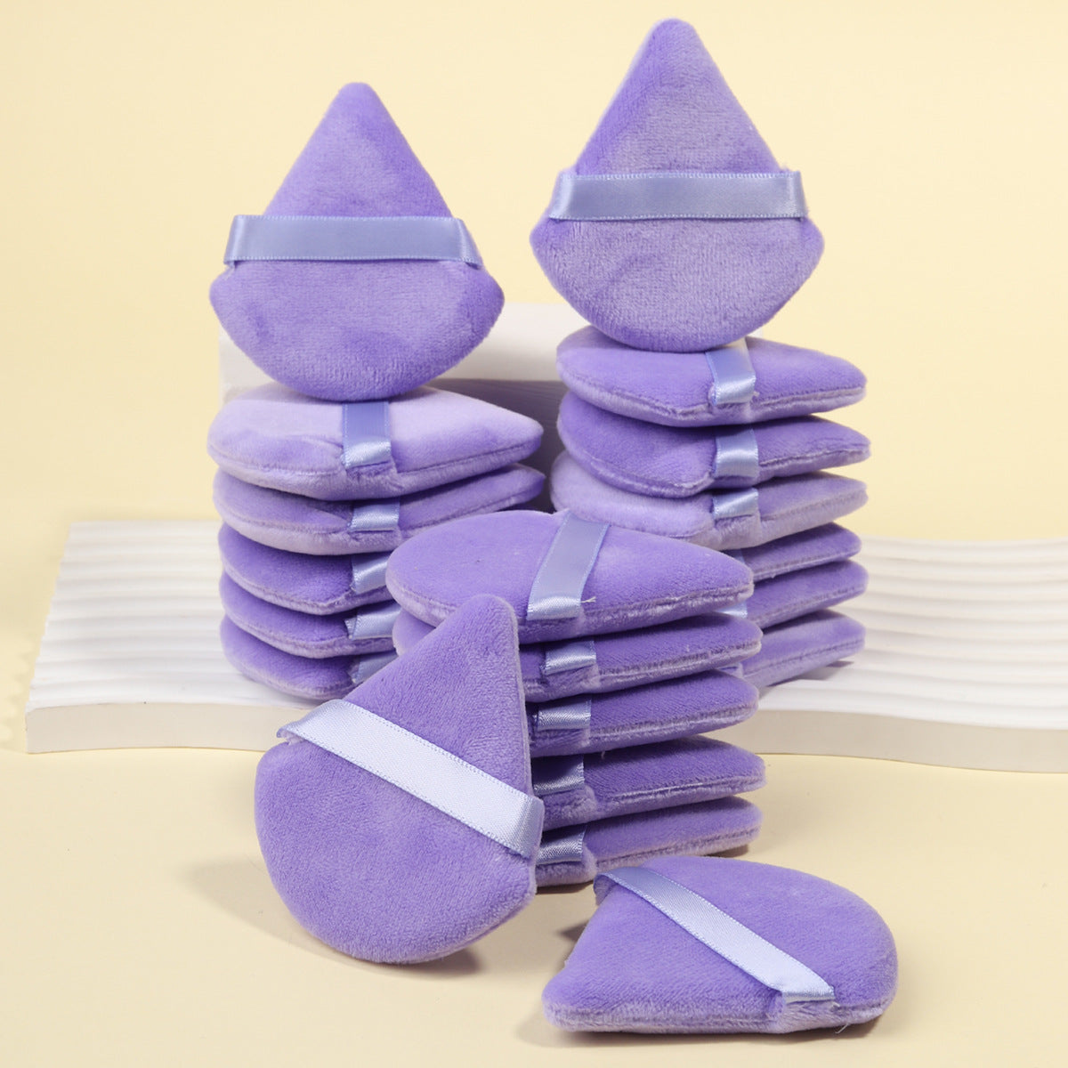 Makeup sponge and powder puff set with foam blenders and velvet puffs in matching tones