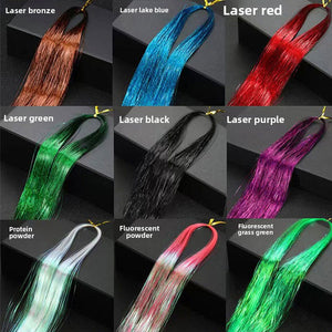 Grid of laser and fluorescent hair tinsel strands laid over dark studio blocks