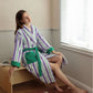 Attached self fabric hood and contrast placket of the striped combed cotton terry bathrobe