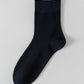 Navy blue bamboo viscose blend mid calf sock laid flat on a pale background