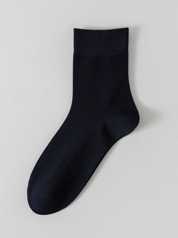 Navy blue bamboo viscose blend mid calf sock laid flat on a pale background
