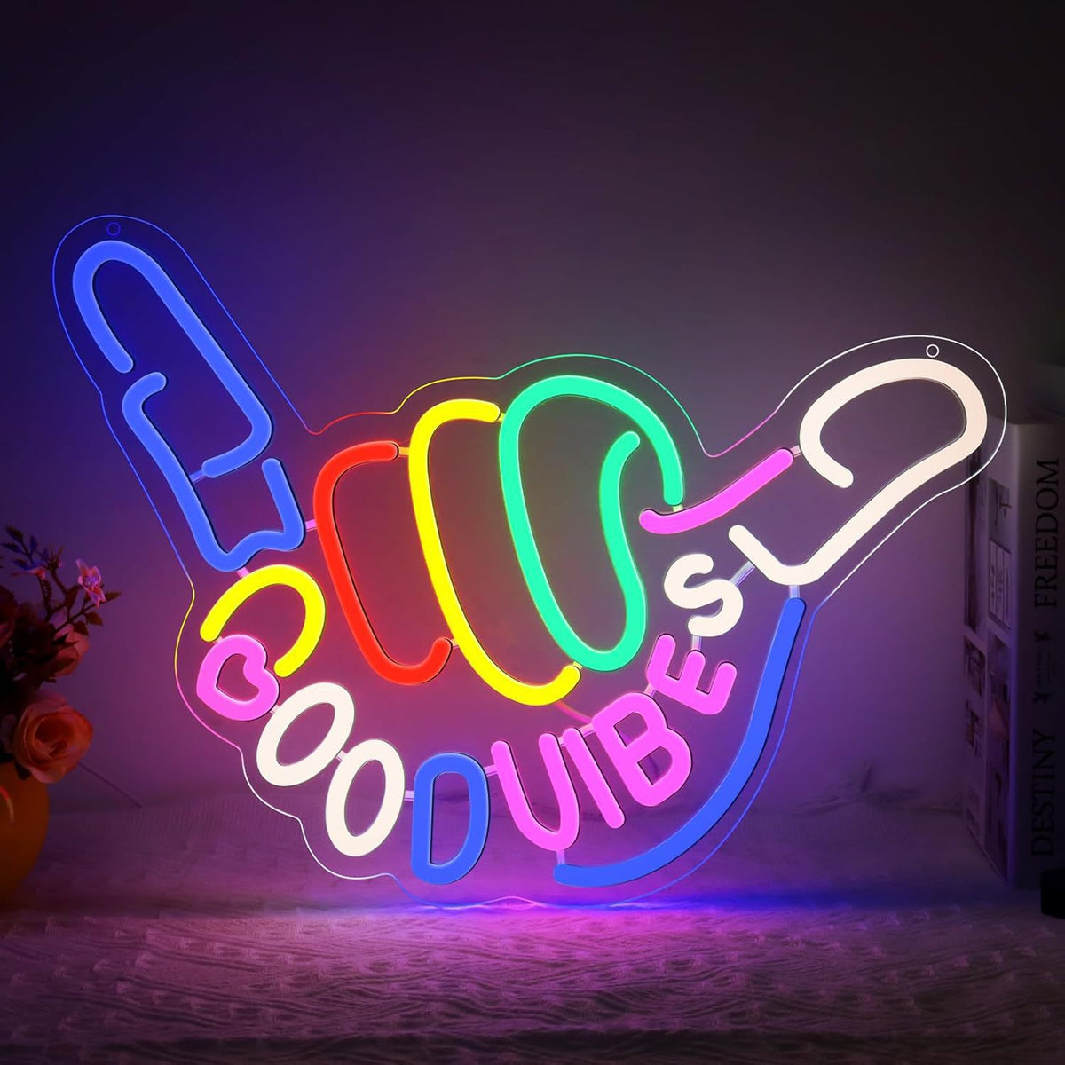 LED neon wall light sign, glowing against a dark wall