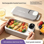 Gray rechargeable heated lunch box with a stainless steel liner holding pasta and fish and a digital display