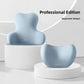 Light blue contoured lumbar cushion and neck headrest pair on white podium