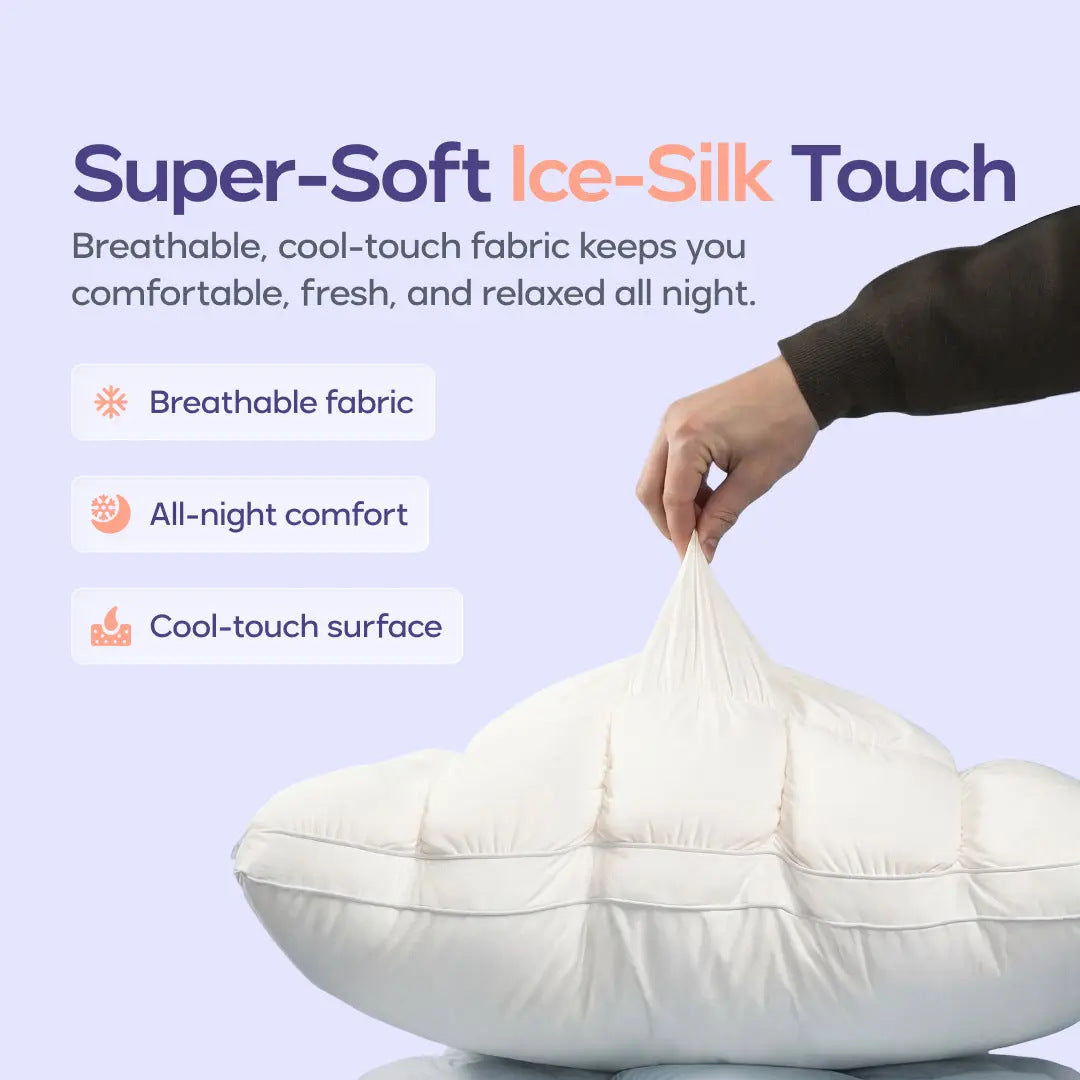 Hand pinching the smooth cool touch cover of a cream puff grid bed pillow