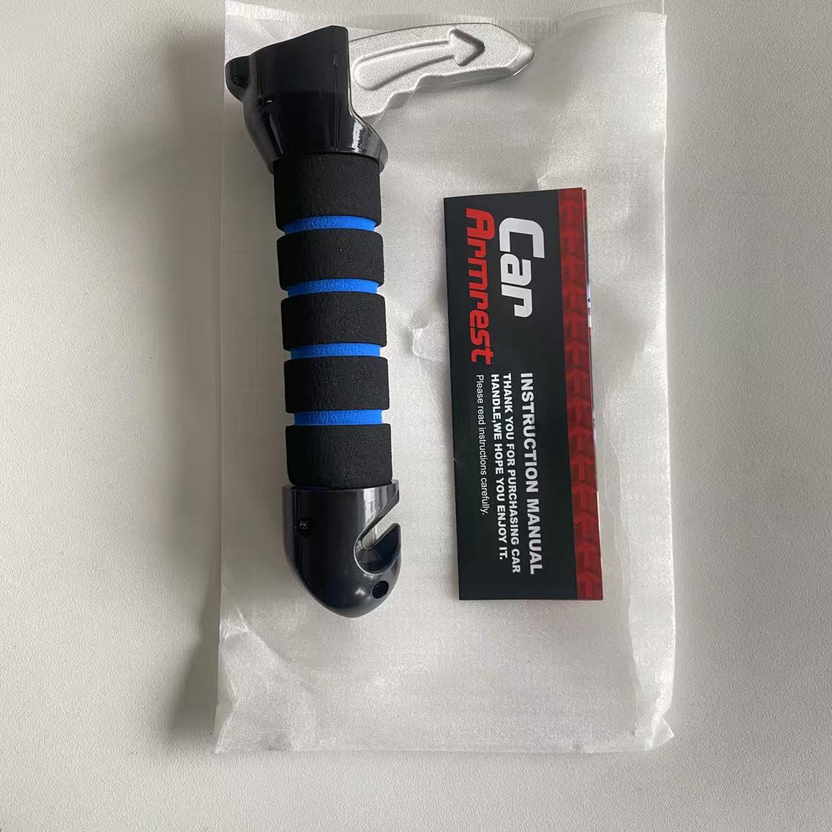 Portable car assist handle with a blue foam grip, silver tip and base notch, shown next to its instruction manual
