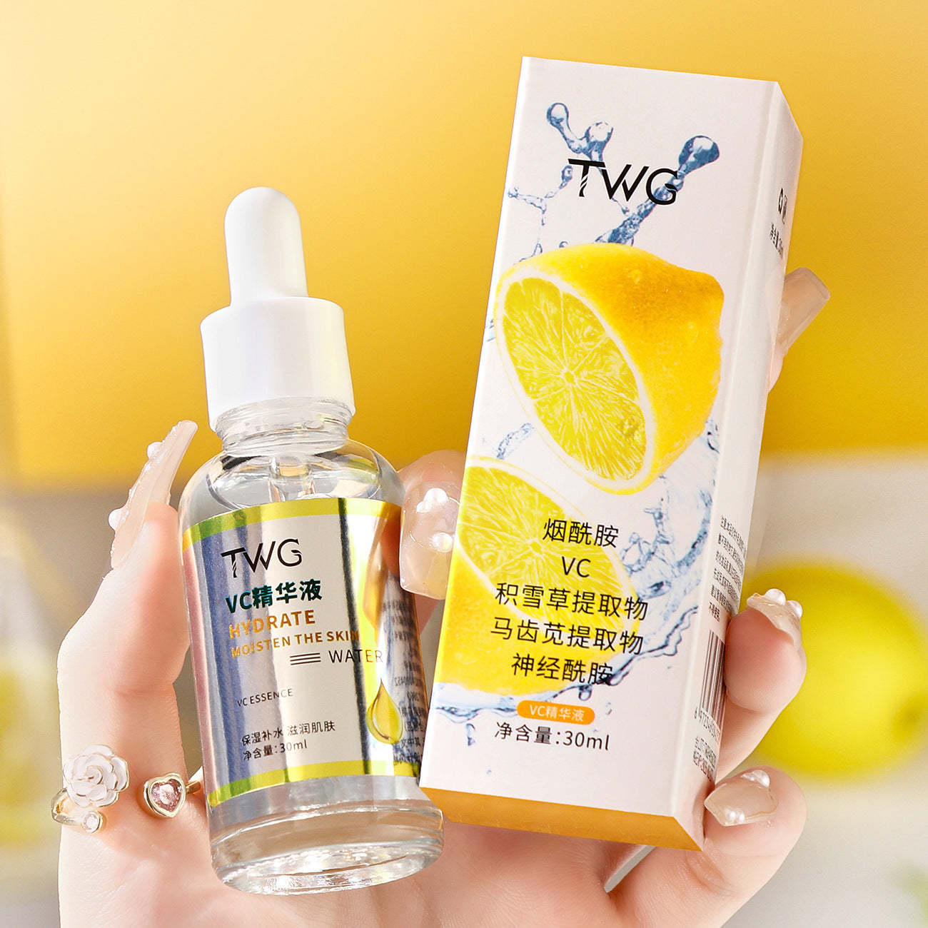 Hand holding TWG VC essence bottle and carton listing niacinamide, VC and ceramide