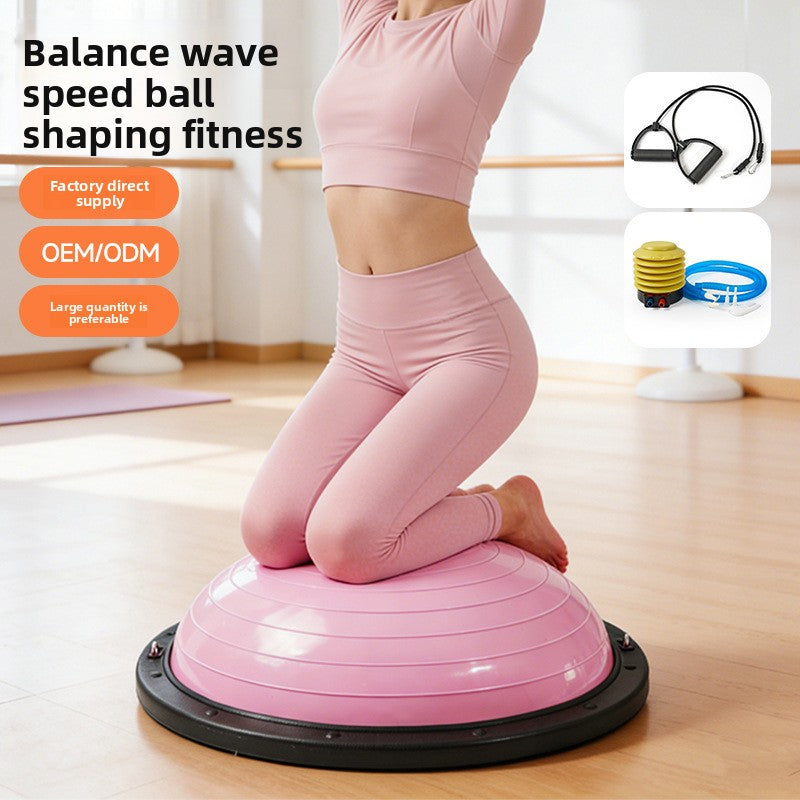 Pink half dome balance trainer in use on a wood floor, hand pump and cords shown beside