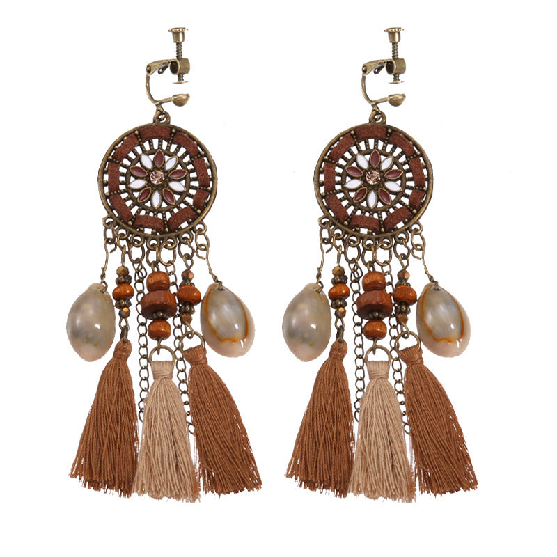 Boho vintage clip-on drop earrings with fringe and bead accents, zinc alloy build, studio image on white background