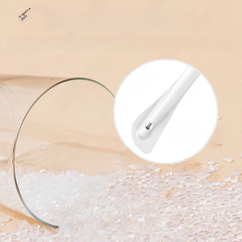 Close up of the food grade silicone scraper head of the kitchen thermometer above silicone pellets