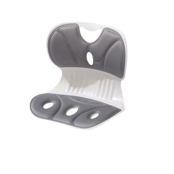 Lumbar support cushion in use against the lower back while seated