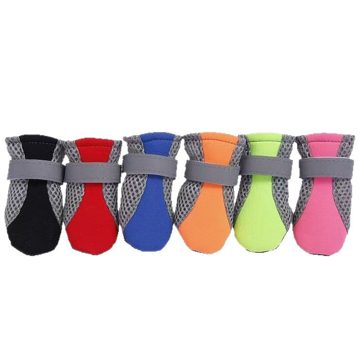 Six colourways of the mesh dog shoe lined up, red blue green pink black and orange