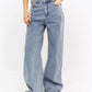 Light wash wide leg baggy jeans full length view