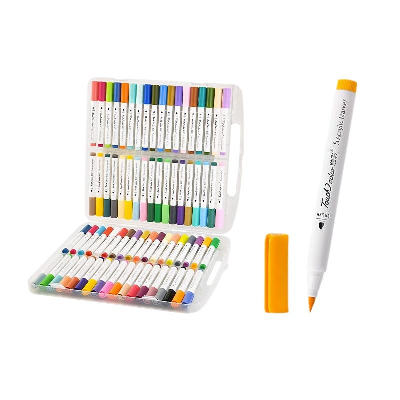 Open acrylic marker case showing the full color range beside a single orange soft brush marker