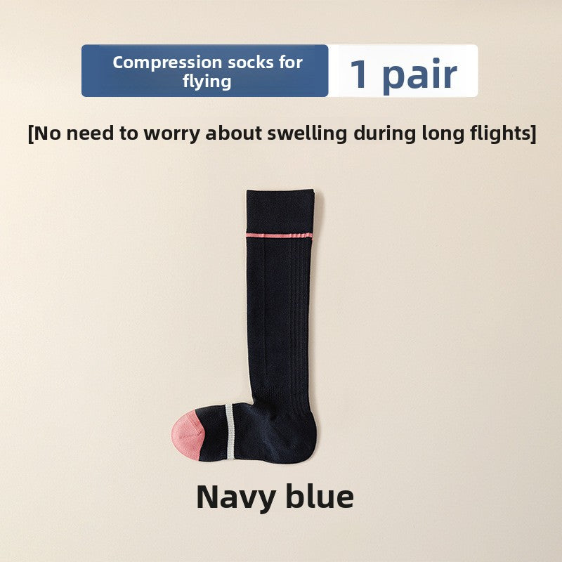 Navy blue high tube compression sock with a thin pink top line and a pink toe, navy blue colorway